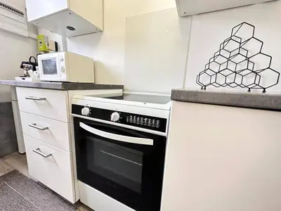 Cuisine ou kitchenette dans l'établissement Reims authentique - entre hôtel de ville et forum