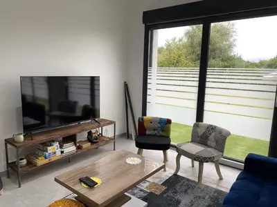 Télévision ou salle de divertissement dans l'établissement Gite de l'etoile