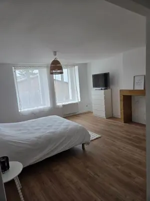 Un ou plusieurs lits dans un hébergement de l'établissement Charmante maison de pierre rénovée a 5min de Charleville-Mézières