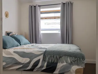 Un ou plusieurs lits dans un hébergement de l'établissement Duplex au coeur de Reims - 2 chambres
