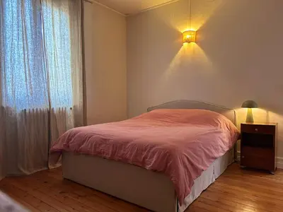 Un ou plusieurs lits dans un hébergement de l'établissement Maison chic et cosy