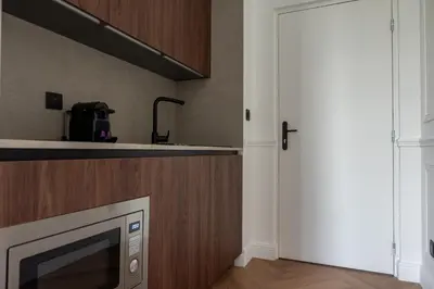 Cuisine ou kitchenette dans l'établissement Suite Arche - Maison les Arcades au pied de la Gare de Charleville-Mézières