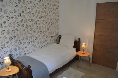 Un ou plusieurs lits dans un hébergement de l'établissement Gîte du Bois la Dame