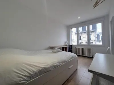 Un ou plusieurs lits dans un hébergement de l'établissement Dubaï - Élégant logement rémois - 10P