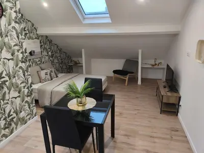 Coin salon dans l'établissement Studio confortable avec parking