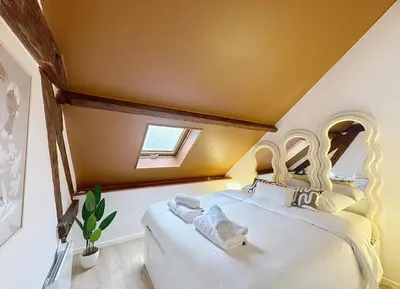 Un ou plusieurs lits dans un hébergement de l'établissement Saint-Nicaise - Appartement de Charme - Maisons de Champagne