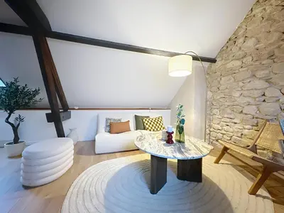 Coin salon dans l'établissement Saint-Nicaise - Appartement de Charme - Maisons de Champagne