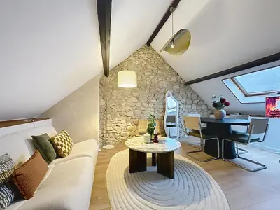 Coin salon dans l'établissement Saint-Nicaise - Appartement de Charme - Maisons de Champagne