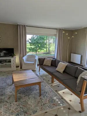 Coin salon dans l'établissement Maison de location