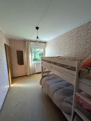Un ou plusieurs lits dans un hébergement de l'établissement Maison de location