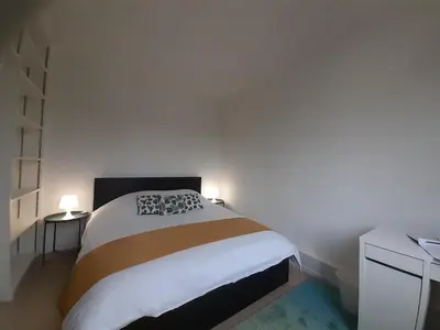 Un ou plusieurs lits dans un hébergement de l'établissement Maison Cosy, proche Reims, La Nichée