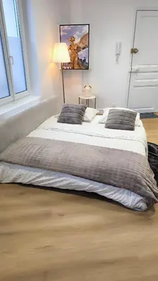 Un ou plusieurs lits dans un hébergement de l'établissement Appartement Prestige Cœur de Reims