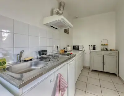 Cuisine ou kitchenette dans l'établissement Le 33 Green Stay