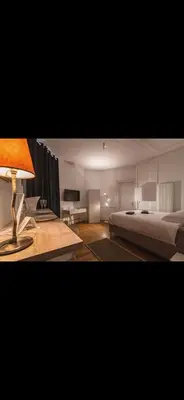 Un ou plusieurs lits dans un hébergement de l'établissement Cathédrale Room's Champagne