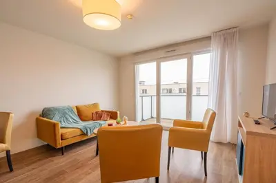 Télévision ou salle de divertissement dans l'établissement Quality Aparthotel Reims - Les Capucins