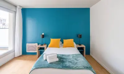Un ou plusieurs lits dans un hébergement de l'établissement Quality Aparthotel Reims - Les Capucins