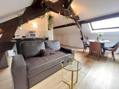 Coin salon dans l'établissement E - Au petit bonheur cosy proche du centre-ville