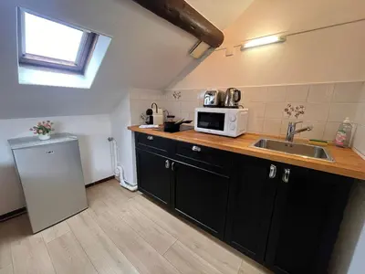 Cuisine ou kitchenette dans l'établissement E - Au petit bonheur cosy proche du centre-ville