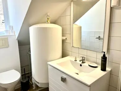 Salle de bains dans l'établissement Au Carino Reims Forum