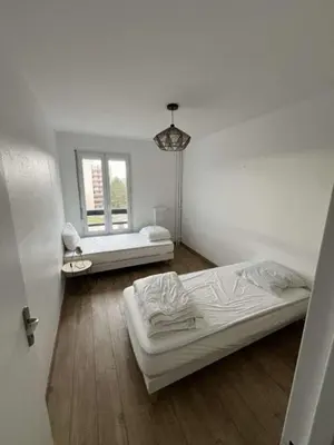Un ou plusieurs lits dans un hébergement de l'établissement Appartement spacieux 4 personnes sixième