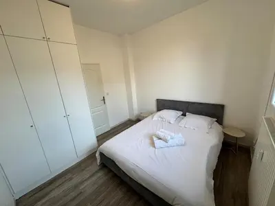 Un ou plusieurs lits dans un hébergement de l'établissement Appartement lumineux et moderne proche gare