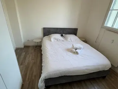 Un ou plusieurs lits dans un hébergement de l'établissement Appartement lumineux et moderne proche gare