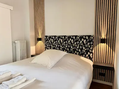Un ou plusieurs lits dans un hébergement de l'établissement Wellness Suite Ponsardin 2 - Reims Centre