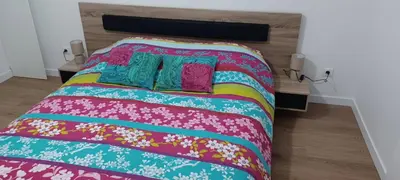 Un ou plusieurs lits dans un hébergement de l'établissement Appartement neuf et cosy