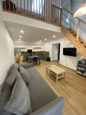 Coin salon dans l'établissement Appartement duplex au calme