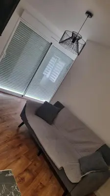 Coin salon dans l'établissement Maisonnette avec jardin Reims centre
