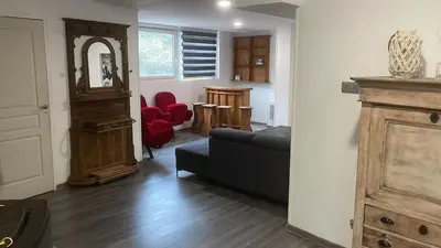 Coin salon dans l'établissement Appartement dans un cadre bucolique