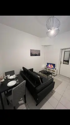 Coin salon dans l'établissement Saint Quentin city center apartment