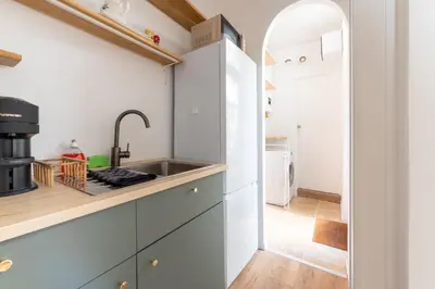 Cuisine ou kitchenette dans l'établissement Le Temps Terrasse