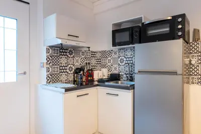 Cuisine ou kitchenette dans l'établissement Le Rétro with private parking