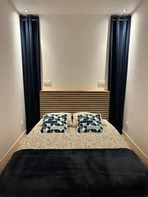 Un ou plusieurs lits dans un hébergement de l'établissement Sublime appartement Rémois