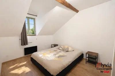Un ou plusieurs lits dans un hébergement de l'établissement Appartement Vue Cathédrale