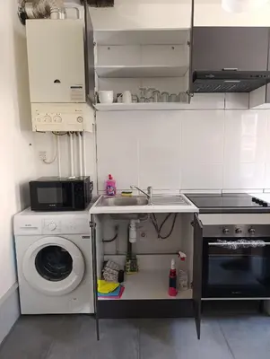 Cuisine ou kitchenette dans l'établissement Appartement Cosy du château