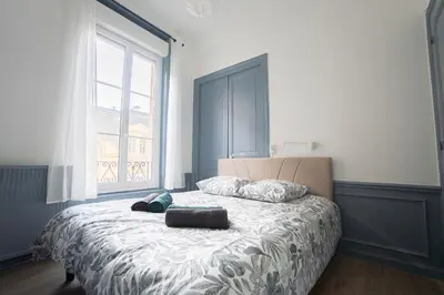 Un ou plusieurs lits dans un hébergement de l'établissement Le Bobo Rémois - Center - Cathedral