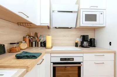 Cuisine ou kitchenette dans l'établissement Escapade à Meaux-Terrasse et proche de Disneyland