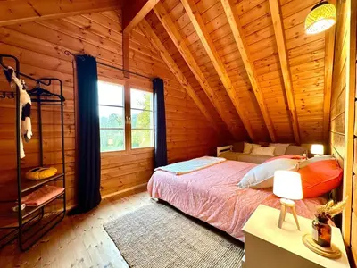 Un ou plusieurs lits dans un hébergement de l'établissement Au Chalet d'Aurélie