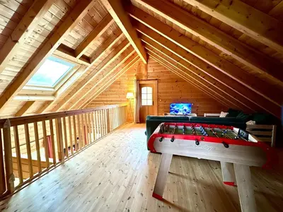 Télévision ou salle de divertissement dans l'établissement Au Chalet d'Aurélie