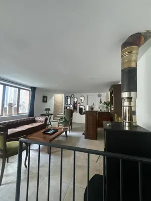 Coin salon dans l'établissement Maison de ville Champenoise