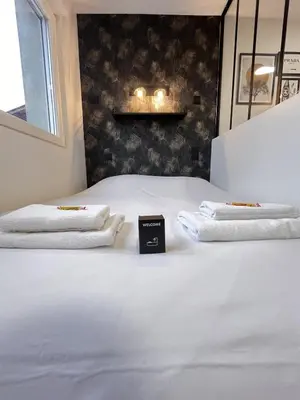 Un ou plusieurs lits dans un hébergement de l'établissement Paris 24 - Studio calme, cosy proche centre Reims