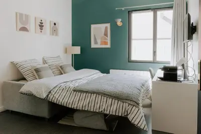Un ou plusieurs lits dans un hébergement de l'établissement Immi Immobilier - Studio Cozy & Équipé