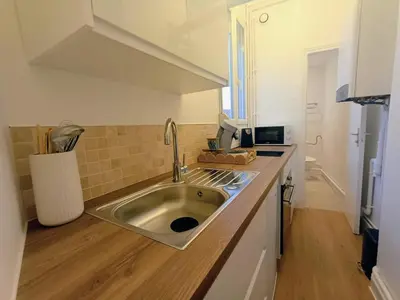 Cuisine ou kitchenette dans l'établissement Appartement lumineux proche hyper-centre