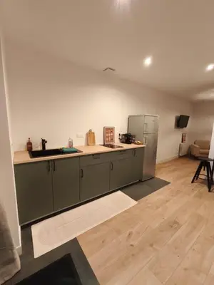 Télévision ou salle de divertissement dans l'établissement Studio à la Ferme