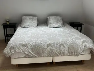 Un ou plusieurs lits dans un hébergement de l'établissement Bel appartement indépendant à proximité Château de Sedan