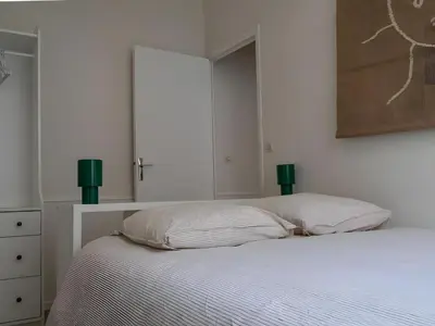 Un ou plusieurs lits dans un hébergement de l'établissement Bel appartement avec jardin privé - Reims Centre