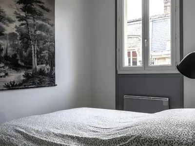 Un ou plusieurs lits dans un hébergement de l'établissement Bel appartement avec jardin privé - Reims Centre