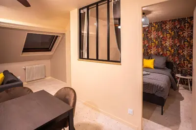 Un ou plusieurs lits dans un hébergement de l'établissement Terres de Soleil - Bohème Chic en cœur St Quentin